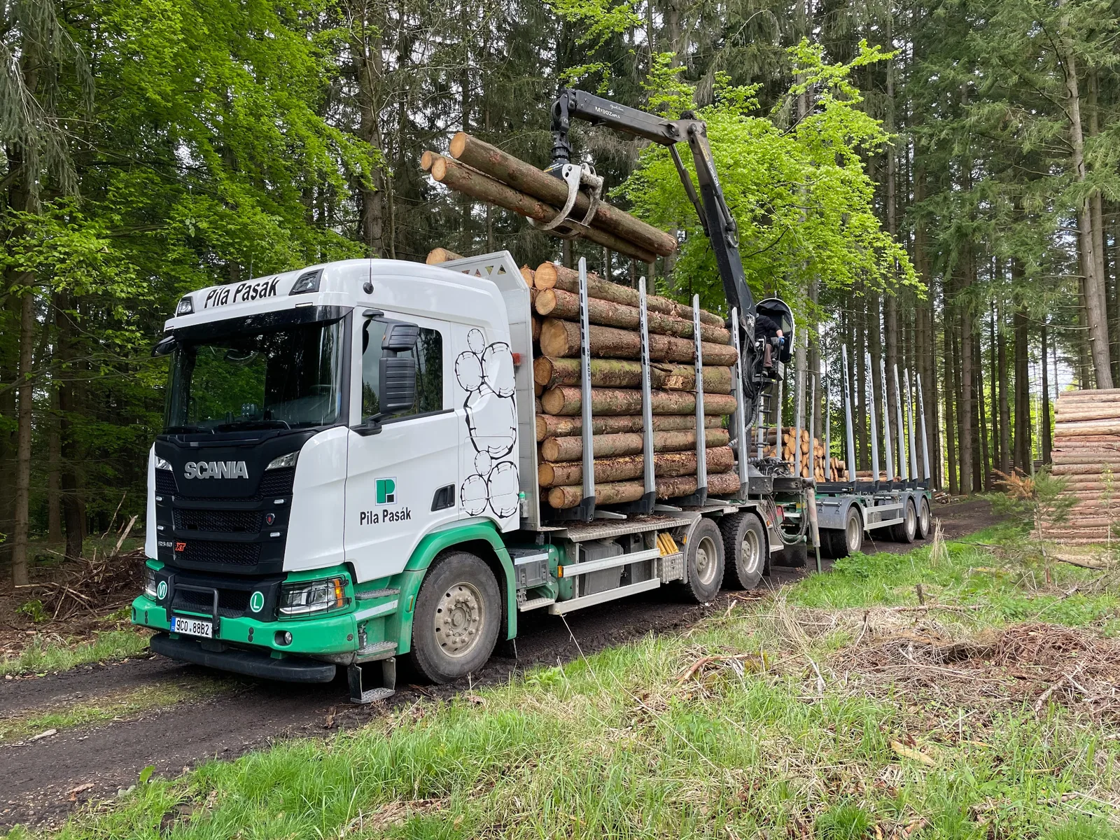 Pila Pasák forestry truck loading responsibly sourced logs