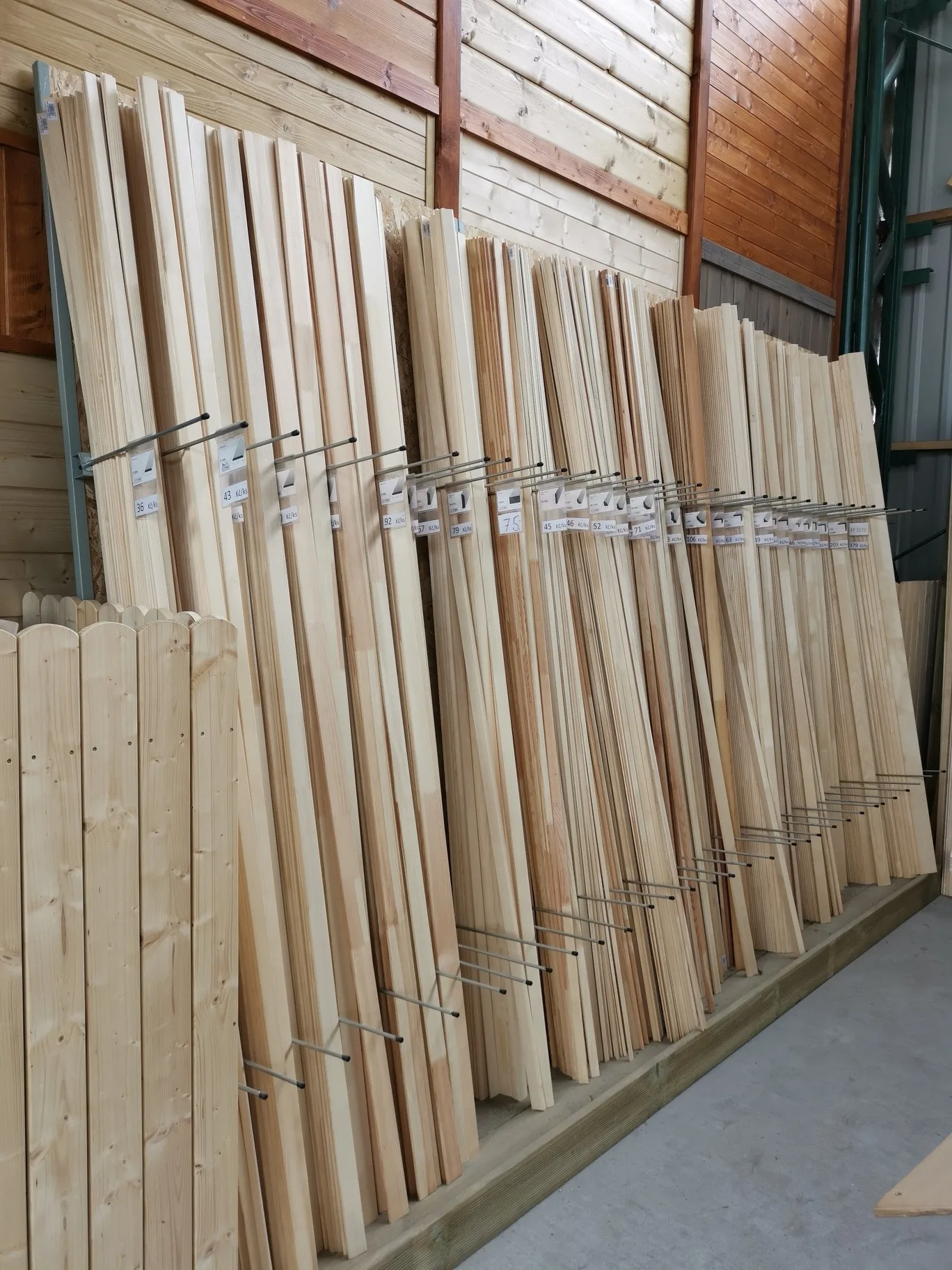 Planed timber boards and wooden mouldings on display