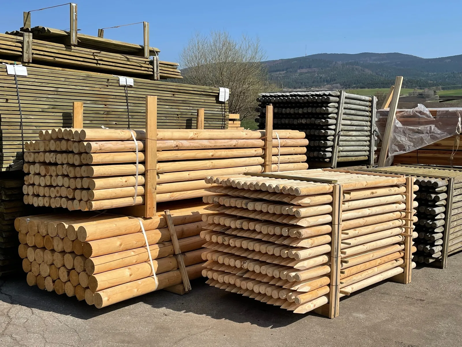 Machined wooden poles and fencing products prepared for customers